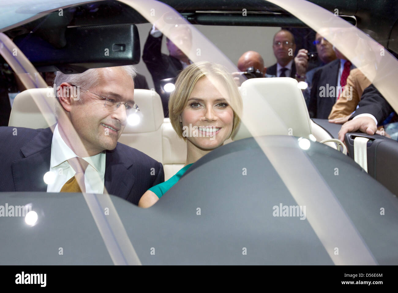 A handout picture released by Volkswagen shows German top model Heidi Klum (R) and Jonathan Browning (L),pPresident and CEO of Volkswagen Group of America sitting in front seats of the new VW Eos Cabrio-Coupé during the L.A. Auto Show at the Convention Center in Los Angeles, United States, 17 November 2010. VW celebrates the world premiere of the new Eos Cabrio-Coupé at the automob Stock Photo