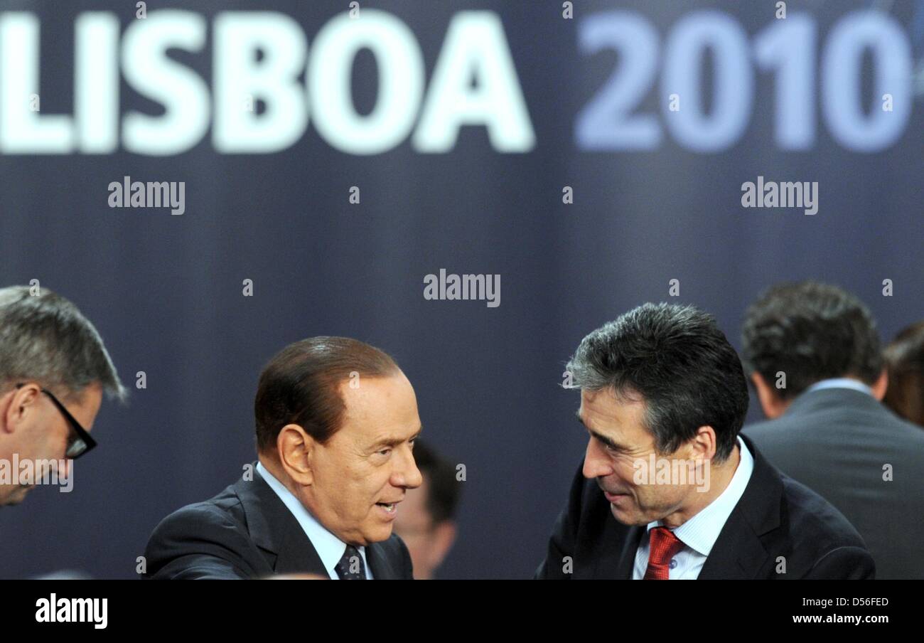 Italian President Silvio Berlusconi (M) and Secretary-General of the NATO, Anders Fogh Rasmussen (R) attend the session on Russia during the NATO summit conference at Lisbon, Portugal, 20 November 2010. Photo: RAINER JENSEN Stock Photo