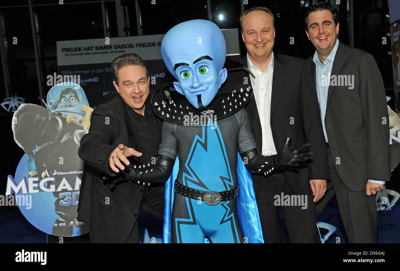 Comedians Oliver Kalkofe (L), Bastian Pastewka and Oliver Welke (R) pose with the film character 'Checker' at the premiere of the film 'Megamind' at Olympiapark in Munich, Germany, 21 November 2010. The 3d animated comedy movie's German theatrical release date is 02 December 2010. photo: URSULA DUEREN Stock Photo