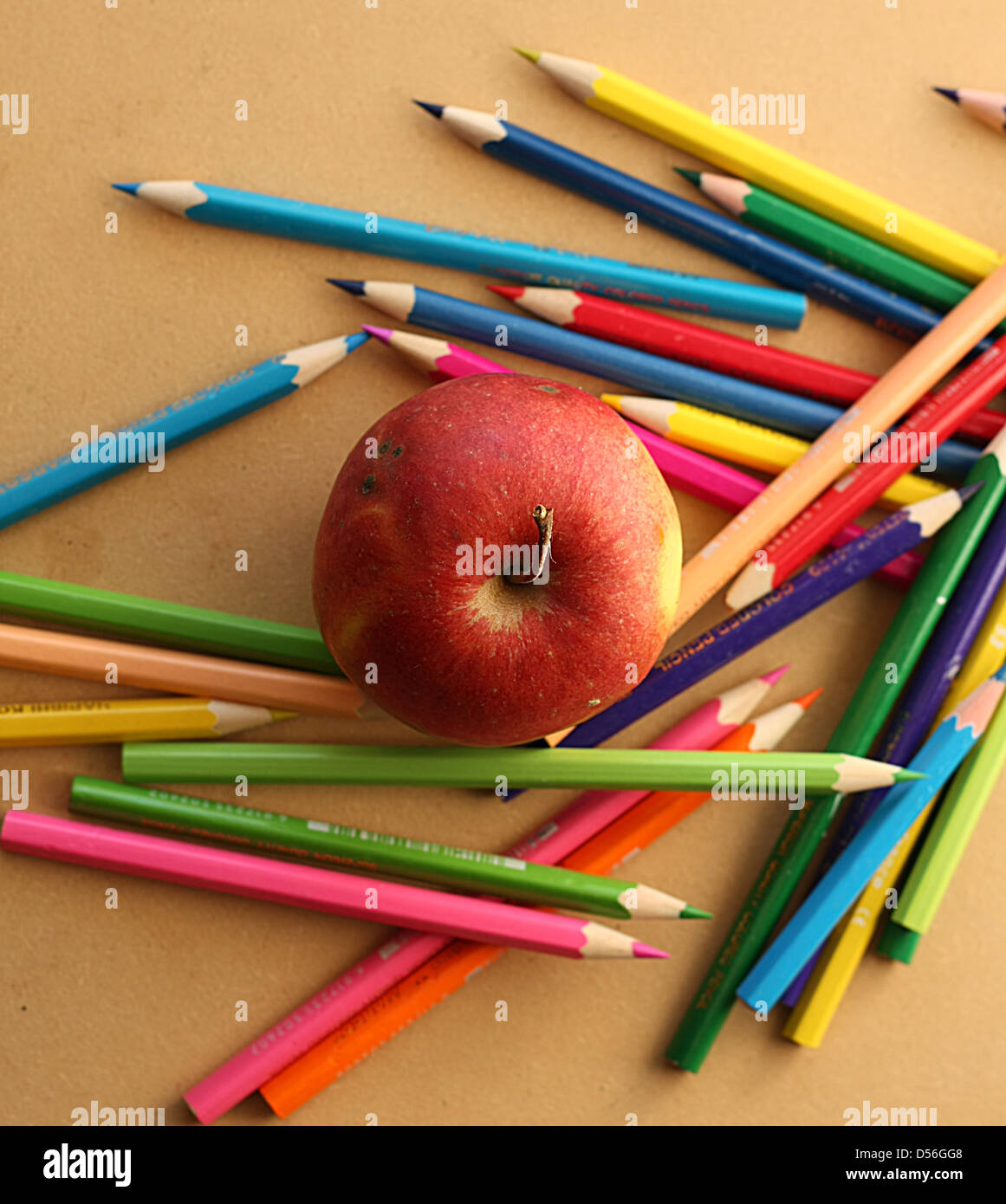 Color pencils with apple Stock Photo Alamy
