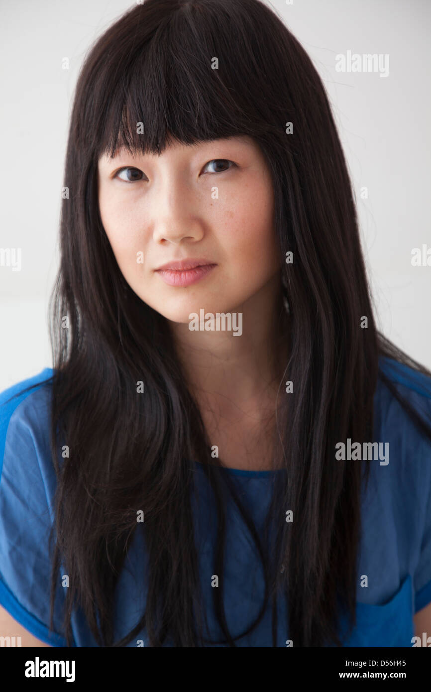 Chinese woman with serious face Stock Photo - Alamy