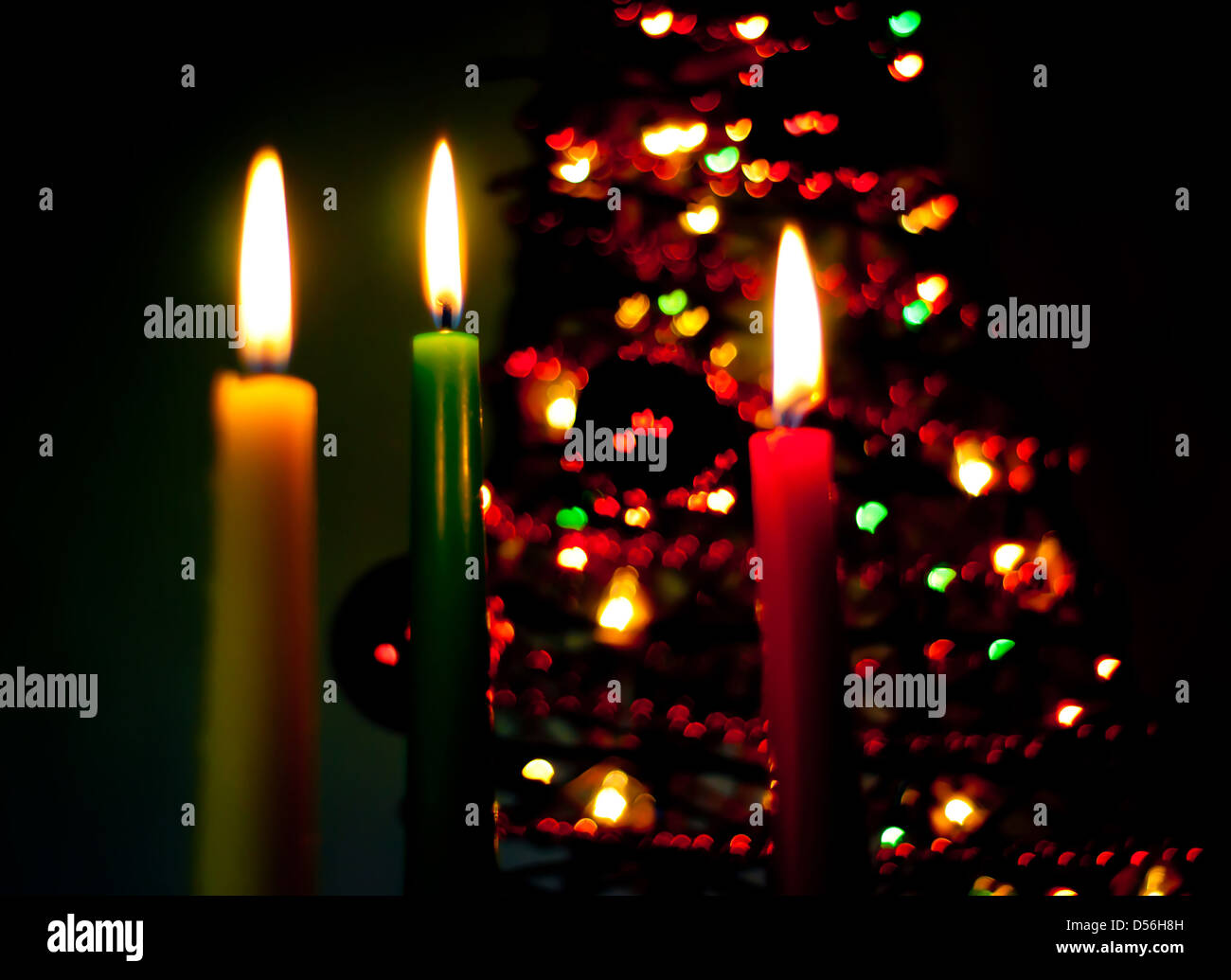 three candles on the black background with hearts Stock Photo - Alamy