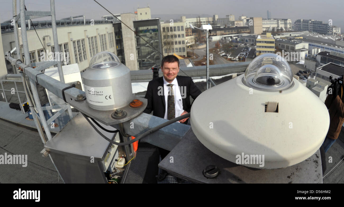 Prof. Dr. Michael Kaufmann of University of Apllied Sciences Jena poses with sensors for UV and solar radiation on the roof of climatologic gauging station in Jena, Germany, 11 March 2010. Since summer 1999 the station measures air temperature, relative humidity, precipitation, wind speed, air pressure and direction. Photo: Jan-Peter Kasper Stock Photo