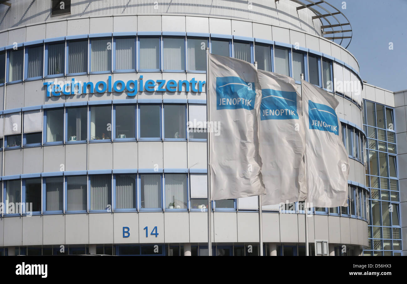 Flags of optoelectronics group Jenoptic AG are visible in front of the