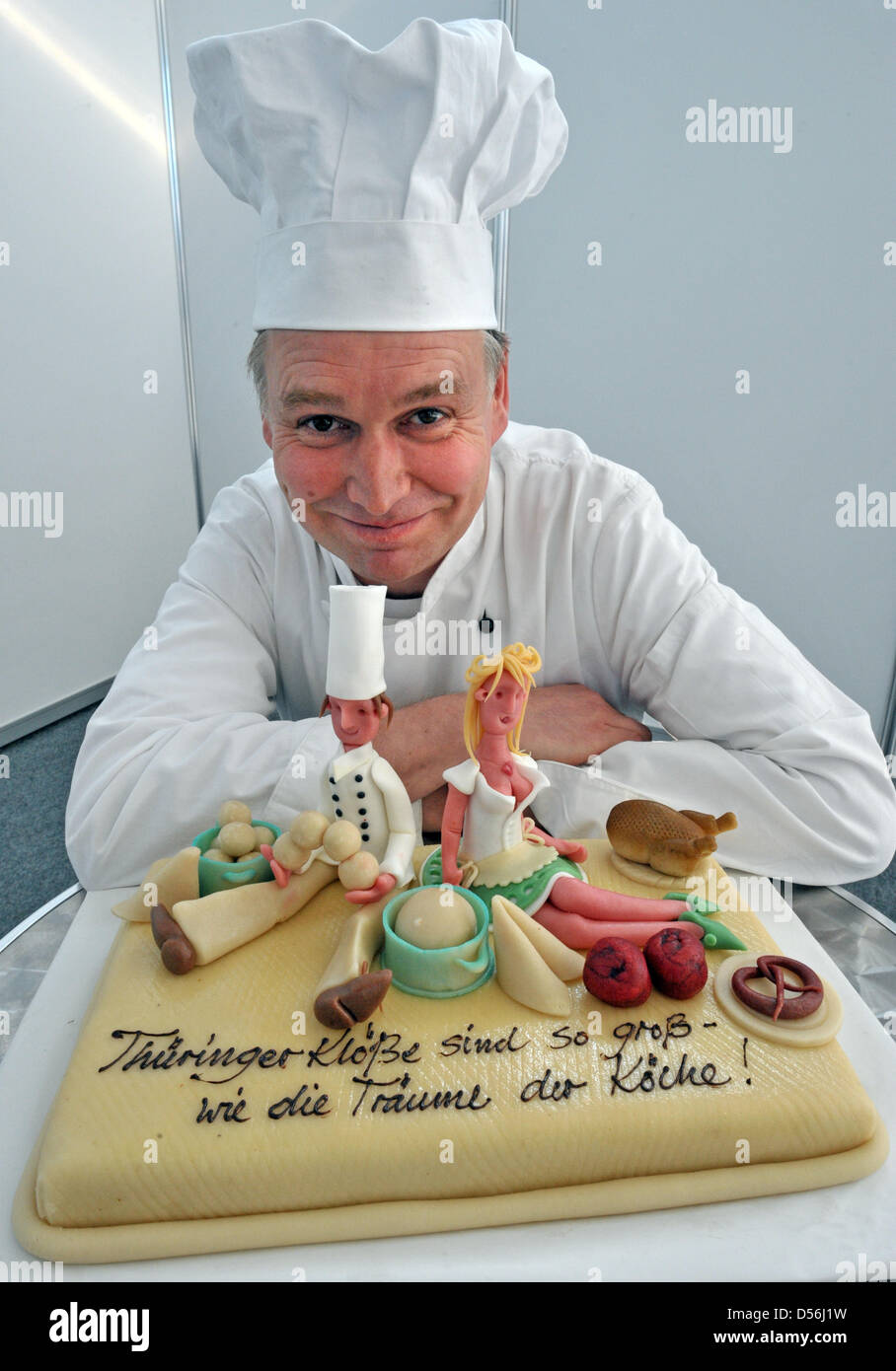 Pastry chef Stefan Lobenstein puts the finishing touch on theme cake