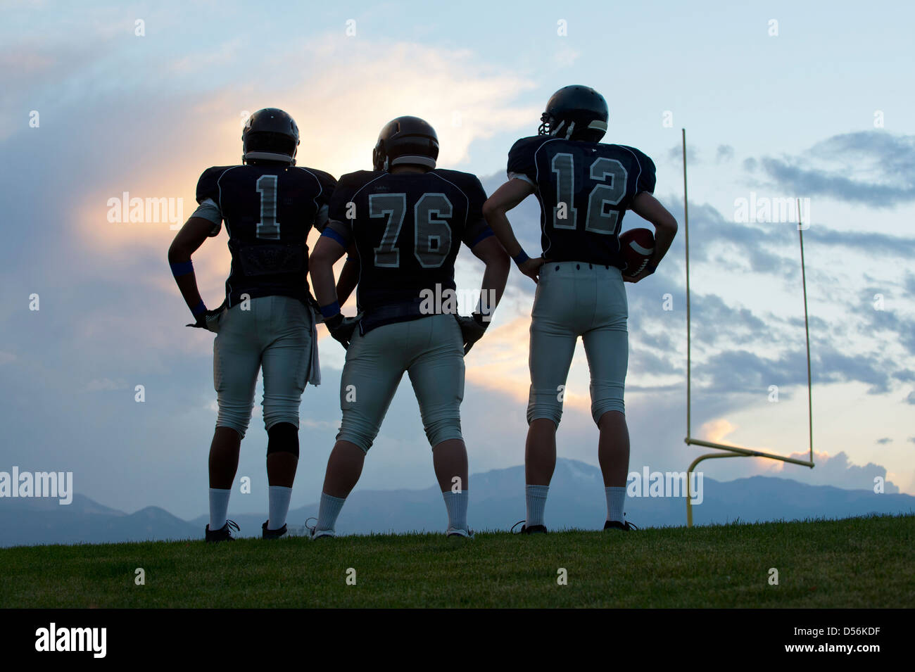 Football players standing on field Stock Photo