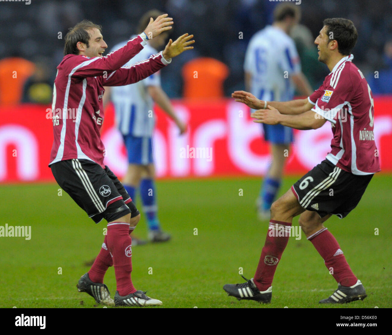 Nuremberg's Javier Pinola (L) and Dominic Marouh cheer after German Bundesliga match Hertha Berlin vs Nuremberg at Olympiastadium in Berlin, Germany, 13 March 2010. The match ended 1-2. Photo: SOEREN STACHE (ATTENTION: EMBARGO CONDITIONS! The DFL permits the further utilisation of the pictures in IPTV, mobile services and other new technologies only no earlier than two hours after  Stock Photo