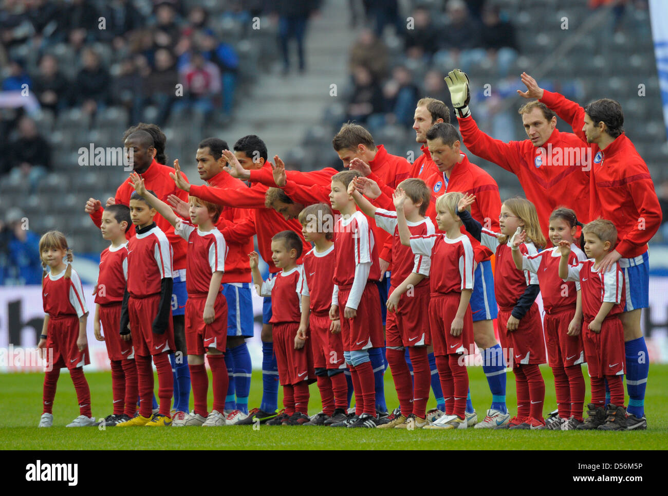 Berlin's players wear red Nike jackets prior to the German Bundesliga match  Hertha Berlin vs Nuremberg at the Olympic stadium in Berlin, Germany, 13  March 2010. Sportswear supplier Nike wants to support