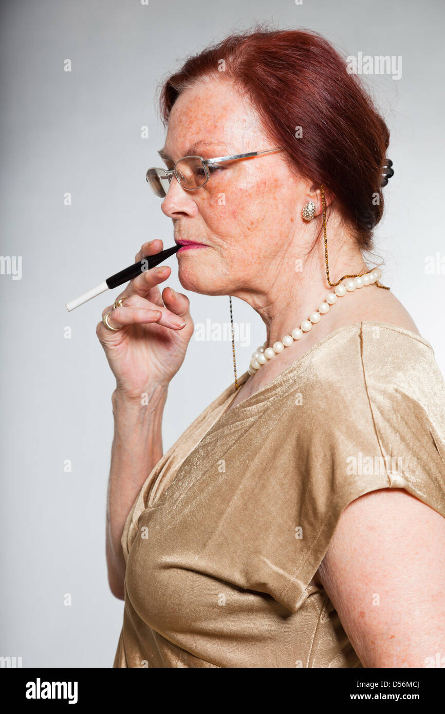 Mature woman smoking cigarette hi-res stock photography and images - Page 6  - Alamy
