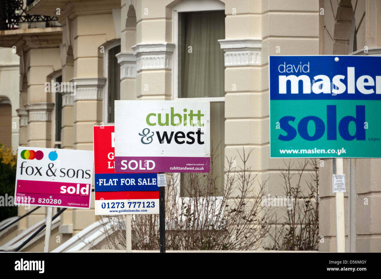 A Collection of Estate Agent, Sold and For Sale Signs in Hove, East Sussex, England Stock Photo