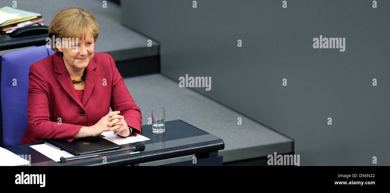 German Chancellor Angela Merkel speaks during the Bundestag budget debate in Berlin, Germany, 17 March 2010. Merkel prepared the citizens for a strict policy of savings, backed up Finance Minister Schaeuble and criticised the expenditure plans of the single ministries for the next year. Merkel spoke of a Herculean task and difficult budget cuts. Photo: RAINER JENSEN Stock Photo