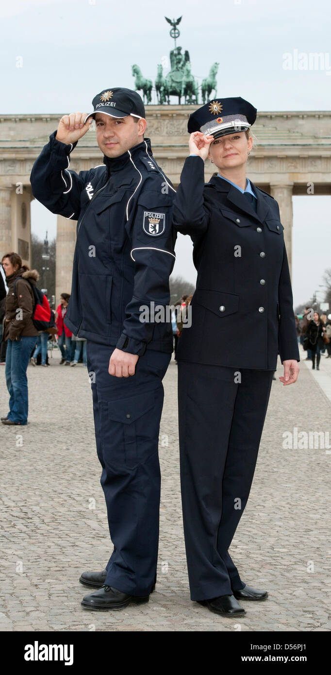Police officers present Berlin police's new uniform in Berlin, Germany, 19  March 2010. Berlin's 16,000 police officers will gradually change from  green to blue uniforms, transition will cost some eleven million euro.