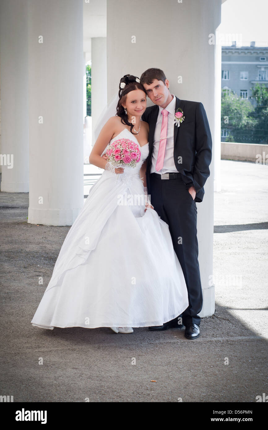 newly-married couple among columns of an ancient building Stock Photo ...
