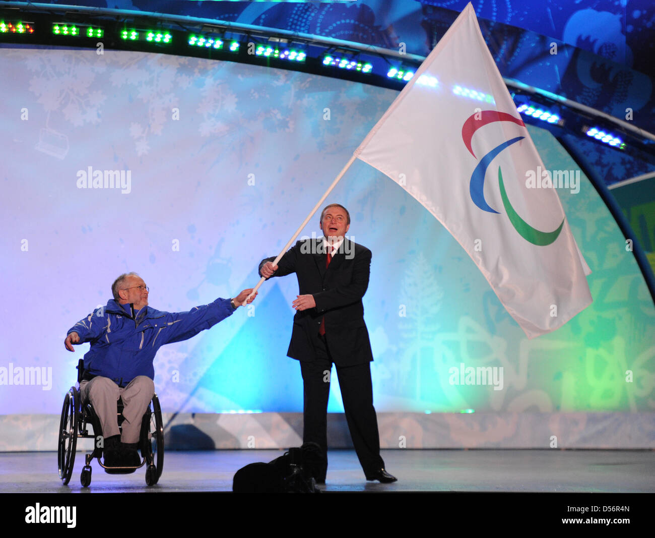 Philip Craven (L), President of the International Paralympic Committee, hands over the Paralympic flag to Sochi Mayor Anatoly Pakhomov during the Closing Cermony of the Paralympics 2010 in Whistler, Canada, 21 March 2010. The next Paralympic Winter Games take place in Sochi, Russia from 07 to 16 March 2014. Photo: Julian Stratenschulte Stock Photo