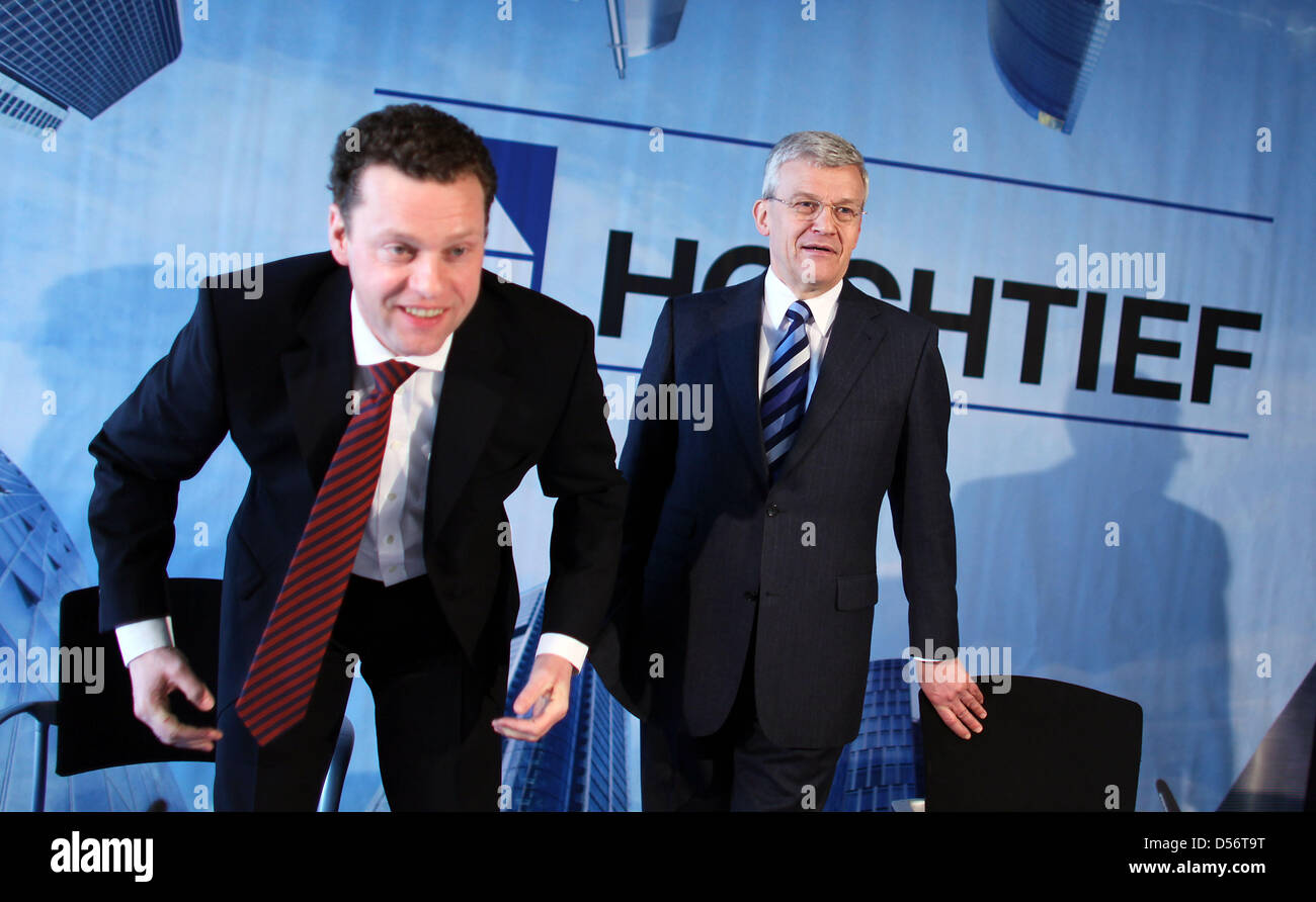 Herbert Lutkestratkotter, CEO of Hochtief, and Burkhard Lohr, Chief Financial Officer, arrive for a press conference on the company's annual report in Duesseldorf, Germany, 25 March 2010. Thanks to positive business results of Australian subsidiary Leighton, Germany's largest construction company Hochtief closed the year of the financial crisis 2009 with an all-time high of peratin Stock Photo