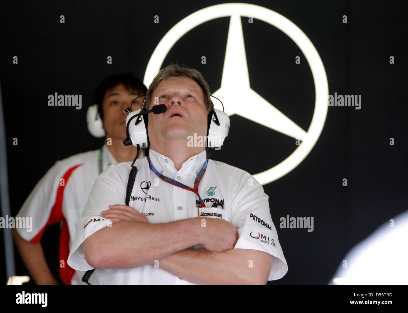 Mercedes motorsports boss Norbert Haug follows the first practice ...