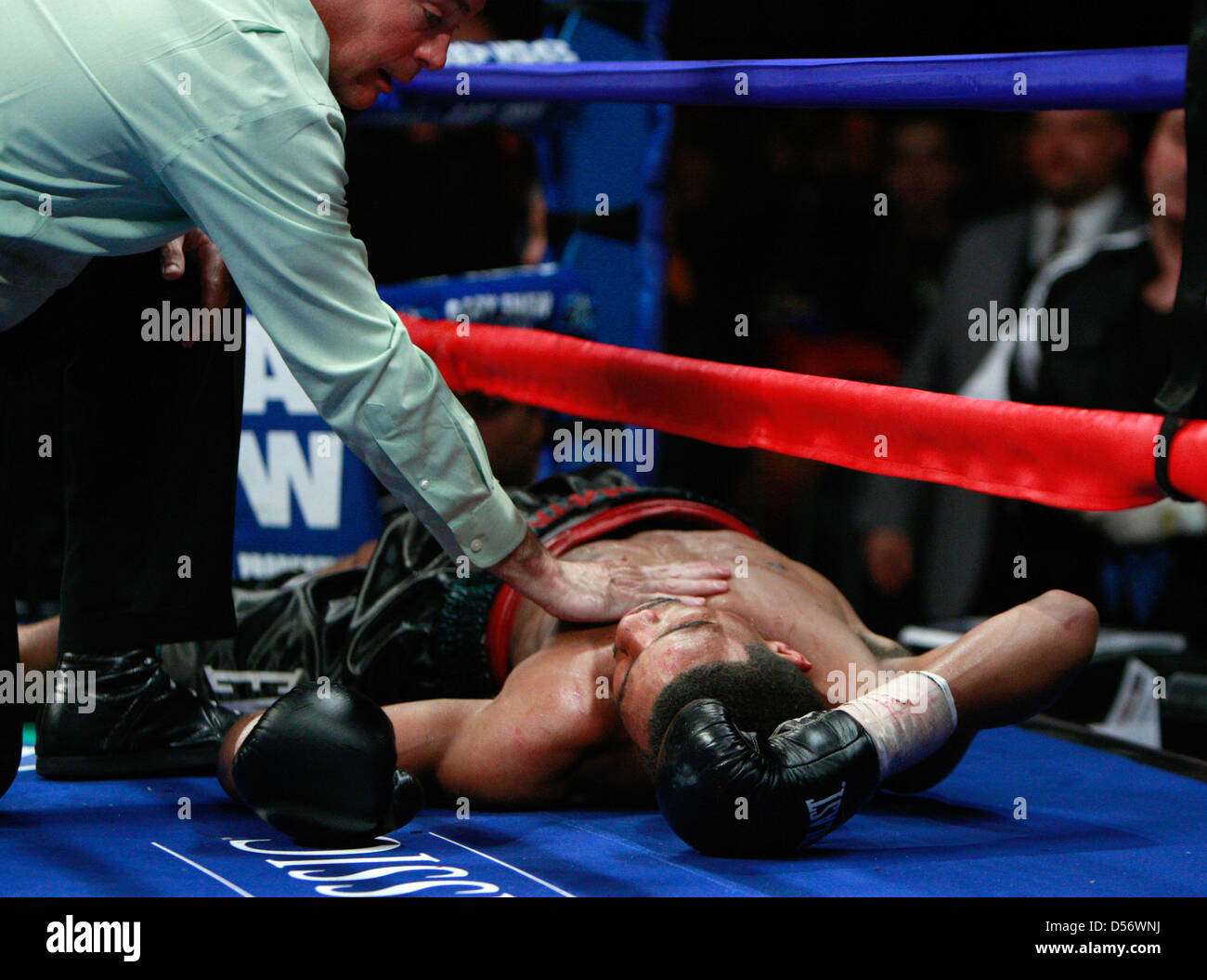 Super middleweight boxer Andre Dirrell on the ground being tended to by
