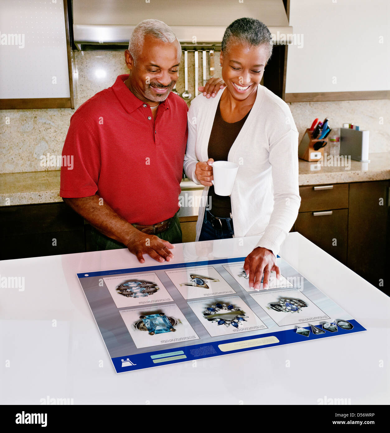 Couple using computer in table Stock Photo Alamy