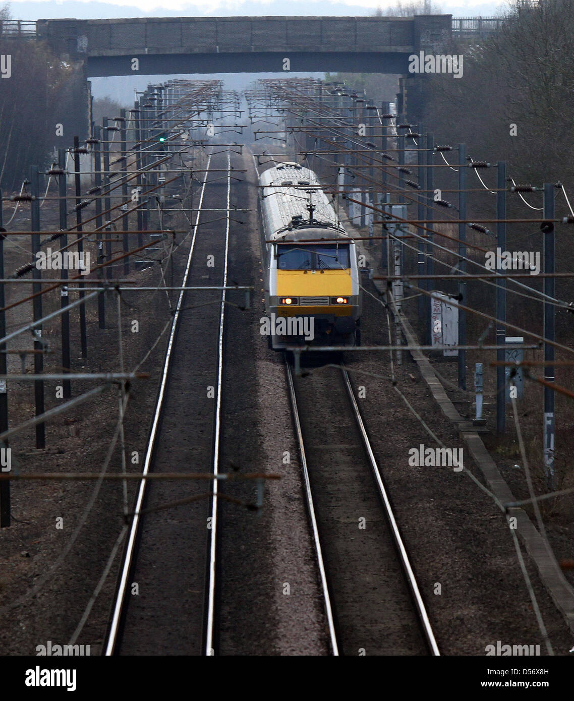 Peterborough, Cambridgeshire, UK. 26th March 2013. An East Coast train travels on the East Coast mainline near Peterborough, Cambridgeshire. The East Coast franchise is expected to be back in private hands in under two years after plans announced today. The Department of Transport have controlled it since November 2009 when it was previously run by National Express. The East Coast runs from London Kings Cross to Edinburgh, continuing on to Inverness and Aberdeen, Scotland. Pic: Paul Marriott Photography. Credit: Paul Marriott / Alamy Live News Stock Photo