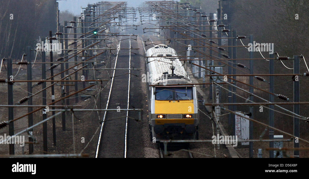 Peterborough, Cambridgeshire, UK. 26th March 2013. An East Coast train travels on the East Coast mainline near Peterborough, Cambridgeshire. The East Coast franchise is expected to be back in private hands in under two years after plans announced today. The Department of Transport have controlled it since November 2009 when it was previously run by National Express. The East Coast runs from London Kings Cross to Edinburgh, continuing on to Inverness and Aberdeen, Scotland. Pic: Paul Marriott Photography. Credit: Paul Marriott / Alamy Live News Stock Photo
