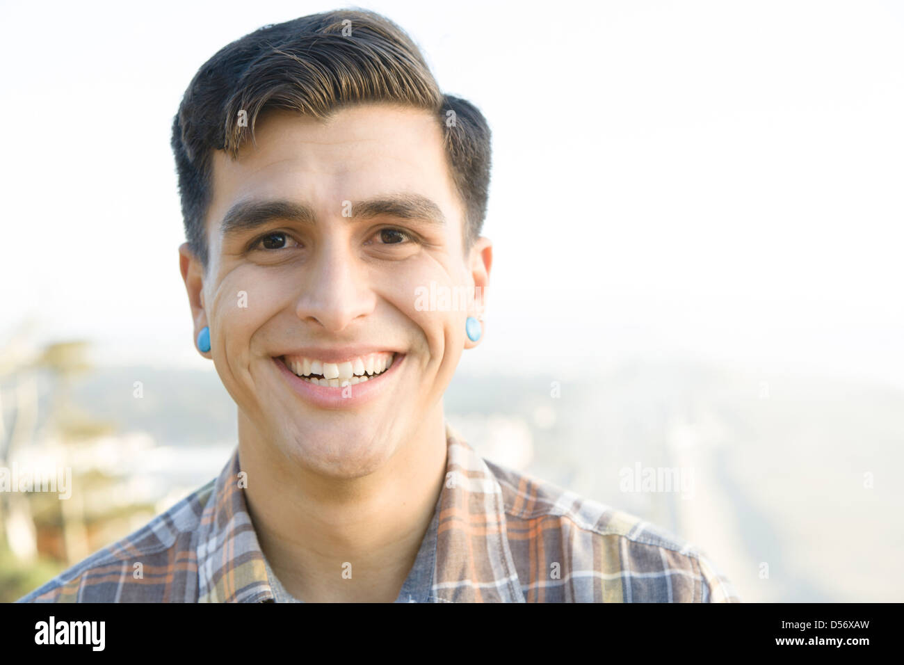 Smiling man standing outdoors Stock Photo - Alamy