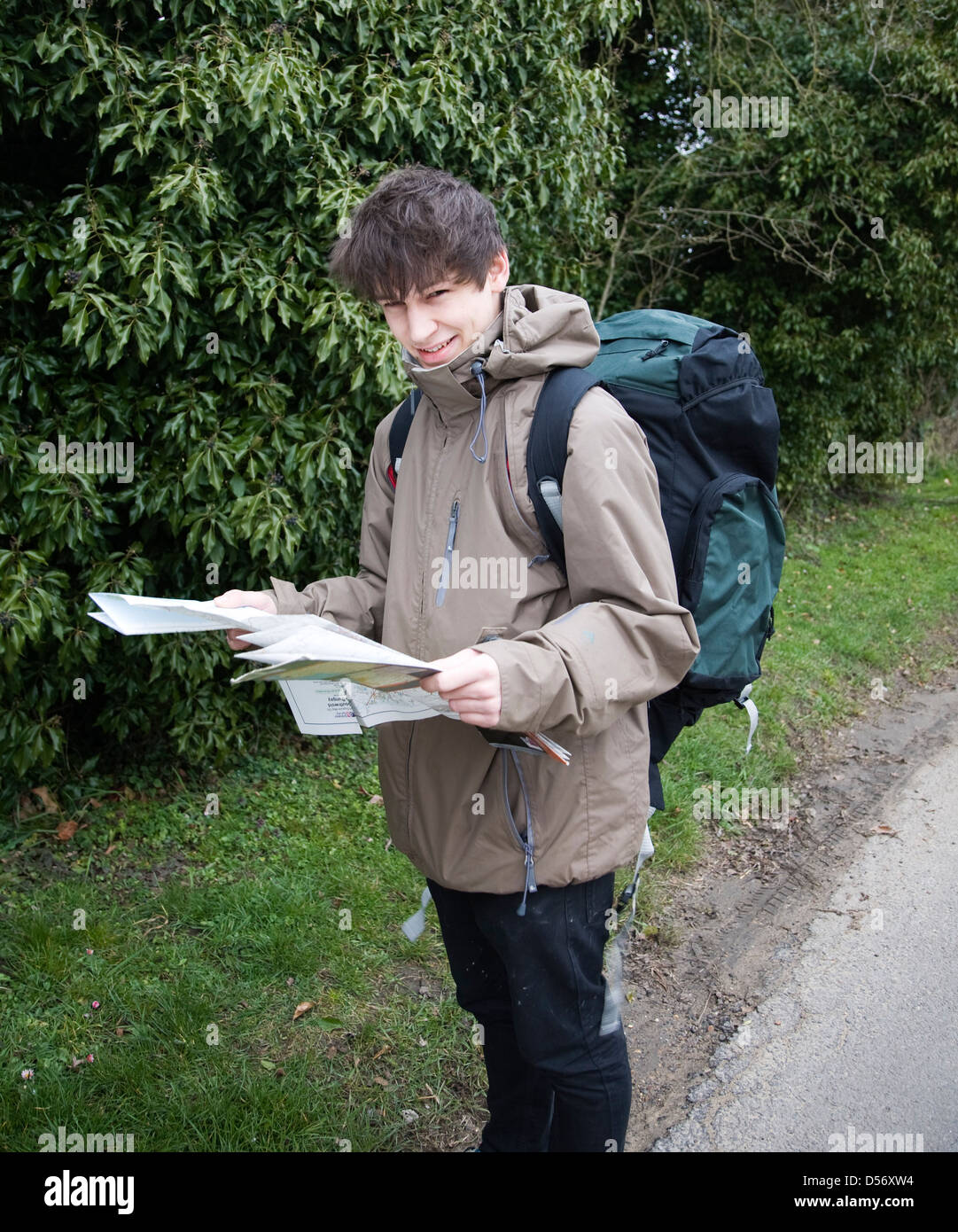 Model released young man hiker map reading Stock Photo