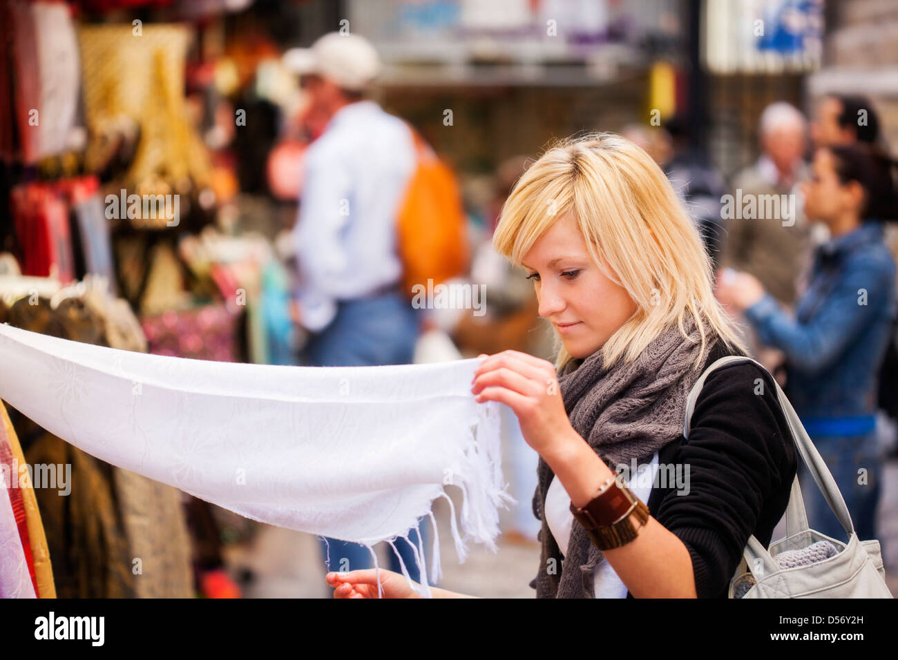 Young blond girl shopping some muslim goods. Stock Photo