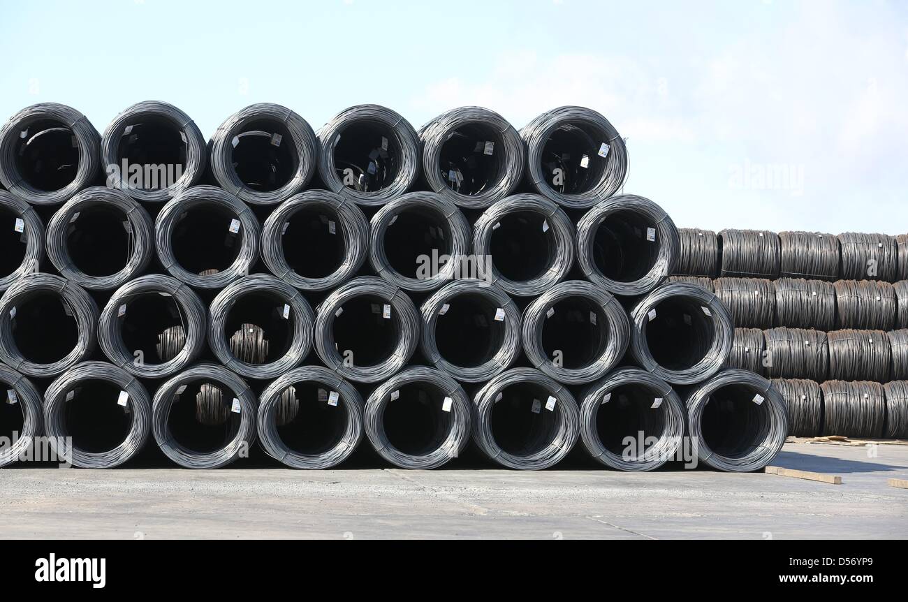 Steel coils are stored on the premises of the ArcelorMittal steel plant in Hamburg, Germany, 25 March 2013. The world's largest steel company ArcelorMittal put a new ladle furnace into operation at its plant in Hamburg. Photo: Christian Charisius Stock Photo