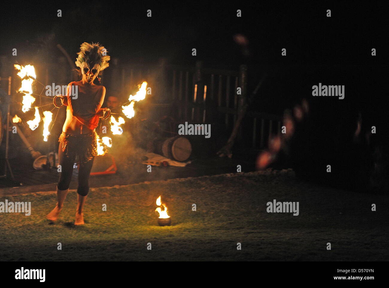 Paarl, South Africa. 24th March, 2013. A fire dancer performs during the Earth hour picnic at the Afrikaanse Taalmonument on March 24, 2013. Earth Hour is an annual worldwide event to help raise awareness about the need to take action on environmental issues. Credit: Lulama Zenzile/Foto24/Gallo Images/ Alamy Live News Stock Photo