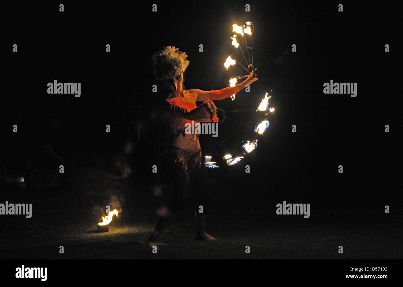 Paarl, South Africa. 24th March, 2013. A fire dancer performs during the Earth hour picnic at the Afrikaanse Taalmonument on March 24, 2013. Earth Hour is an annual worldwide event to help raise awareness about the need to take action on environmental issues. Credit: Lulama Zenzile/Foto24/Gallo Images/ Alamy Live News Stock Photo