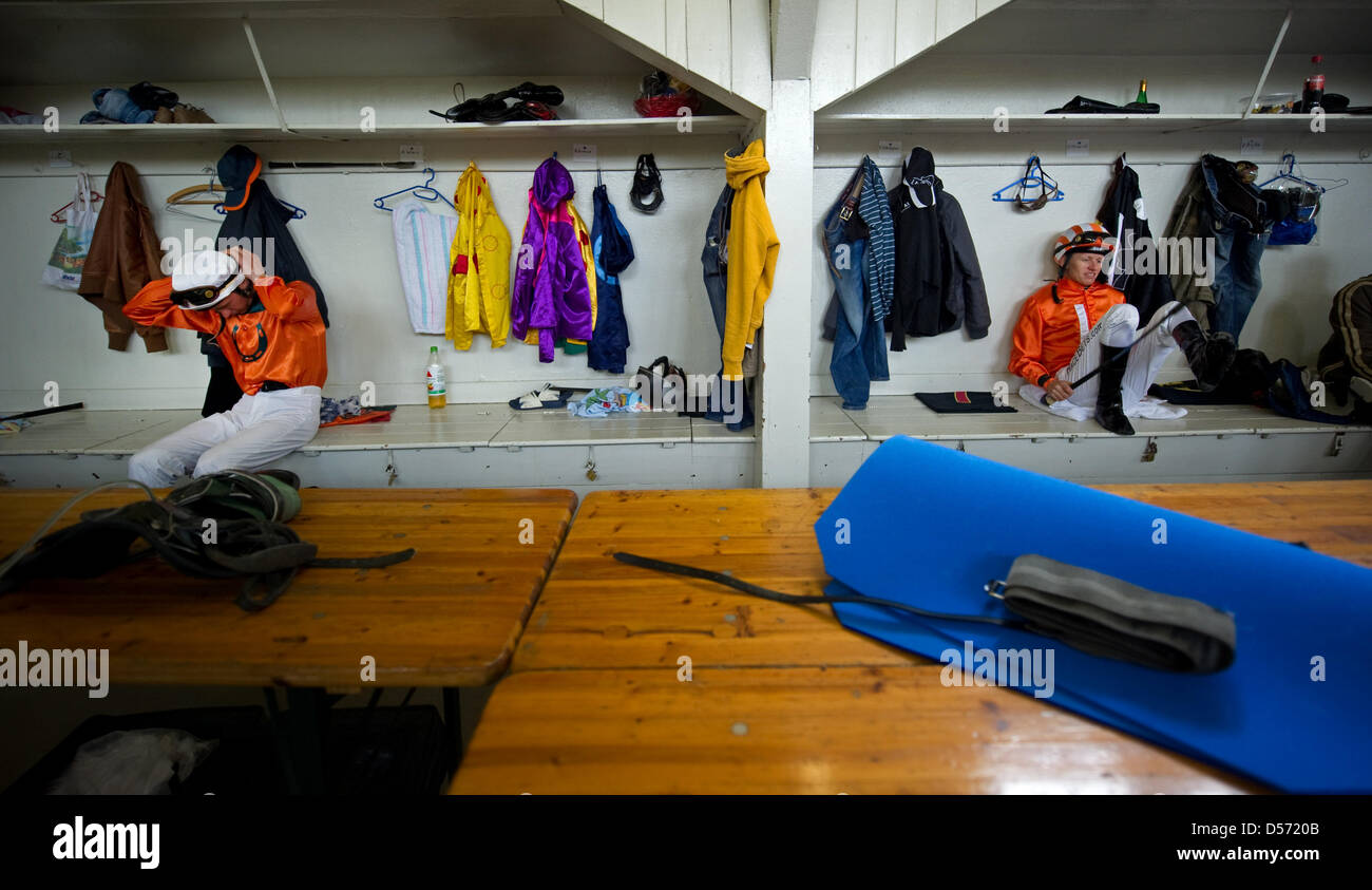 Jockeys wait for their race in the locker room at the horse race track in Hoppegarten, Brandenburg, Germany, 04 April 2010. The 142nd racing season kicked off with seven races over the weekend. Photo: Arno Burgi Stock Photo