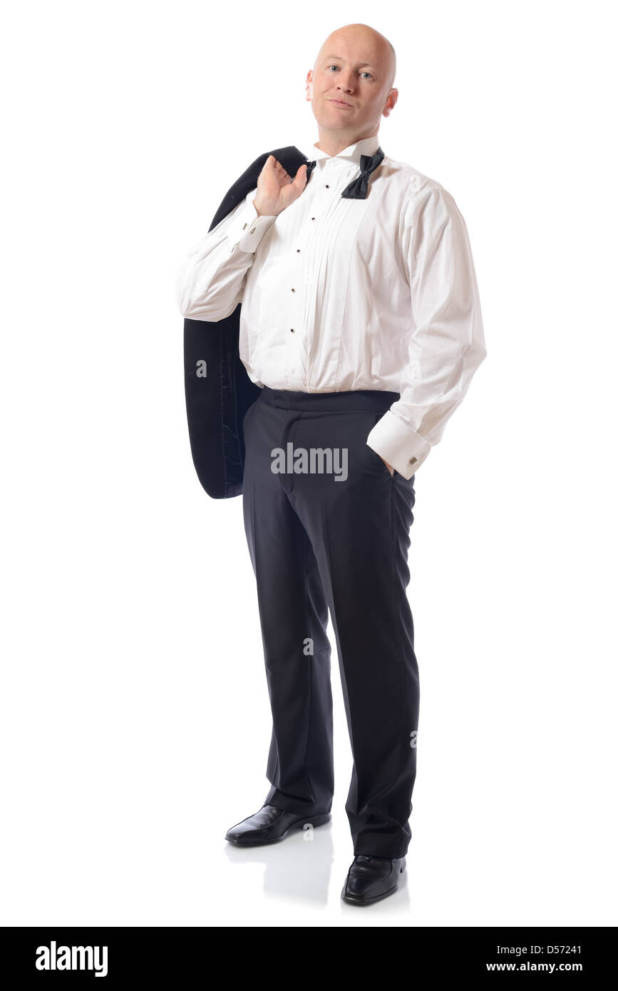 man in tuxedo with jacket off relaxed isolated on white Stock Photo