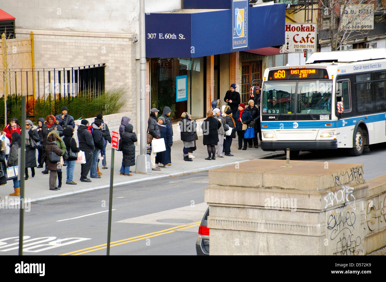 Commuters Waiting At Bus Stop Mta Q60 Public Transportation Bus