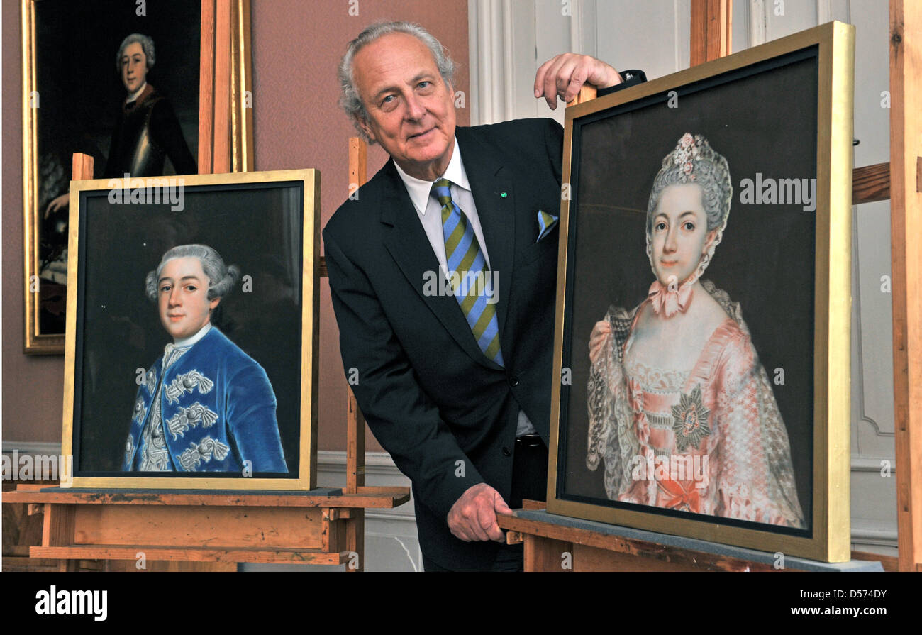 Eduard Prince of Anhalt smiles with two significant paintings by German painter Christoph Friedrich Reinhold Lisiewski (1725-1794) he received at Moigkau Palace in Dessau, Germany, 15 April 2010. The pastel paintings 'Leopold Frederick Franz of Anhalt-Dessau' (L) and 'Henriette Catharina Agnese of Anhalt-Dessau' (R) were made some 250 years ago and derive from from the former prope Stock Photo