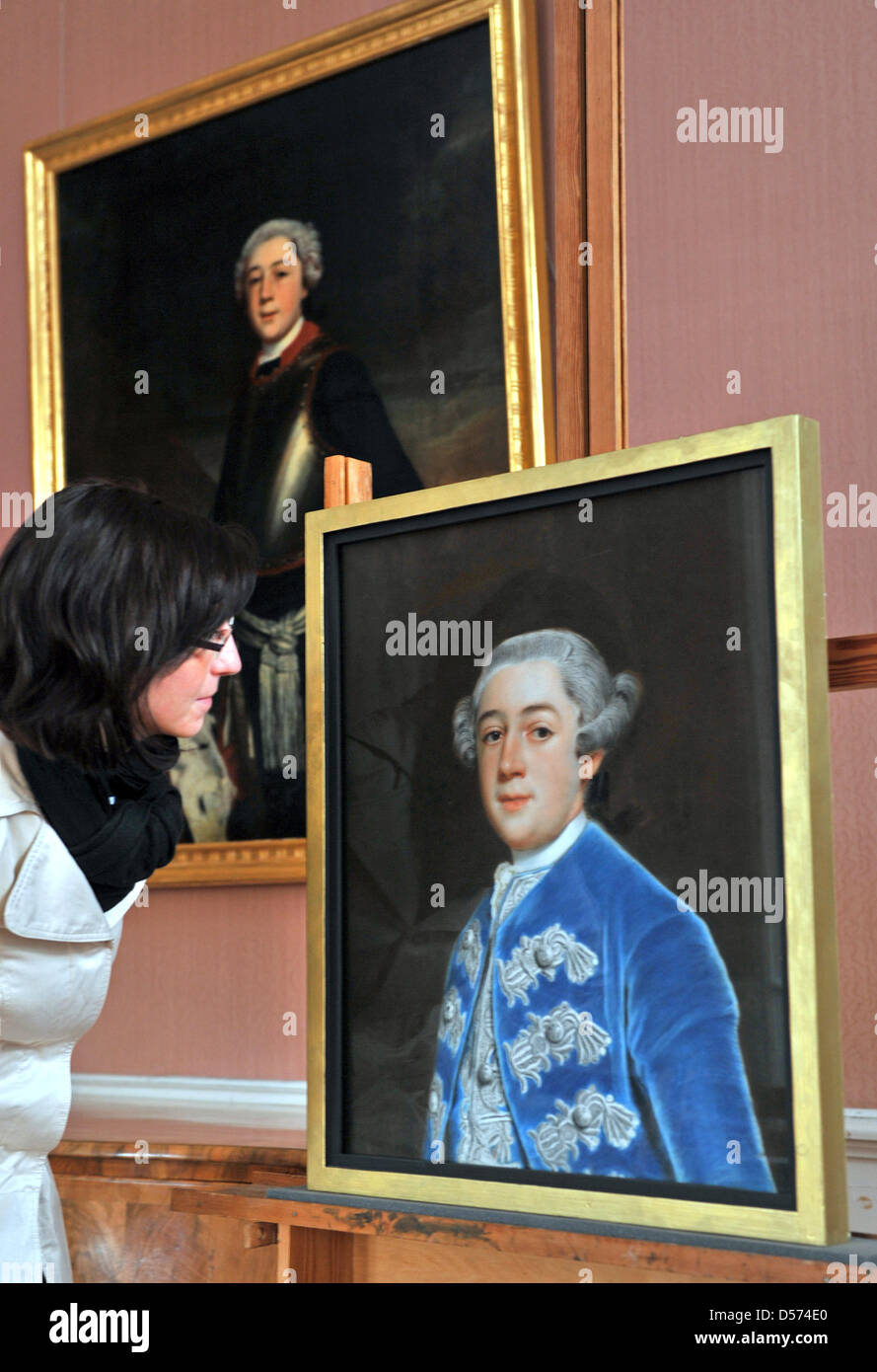 Eduard Prince of Anhalt smiles with two significant paintings by German painter Christoph Friedrich Reinhold Lisiewski (1725-1794) he received at Moigkau Palace in Dessau, Germany, 15 April 2010. The pastel paintings 'Leopold Frederick Franz of Anhalt-Dessau' (R) and 'Henriette Catharina Agnese of Anhalt-Dessau' (not pictured) were made some 250 years ago and derive from from the f Stock Photo