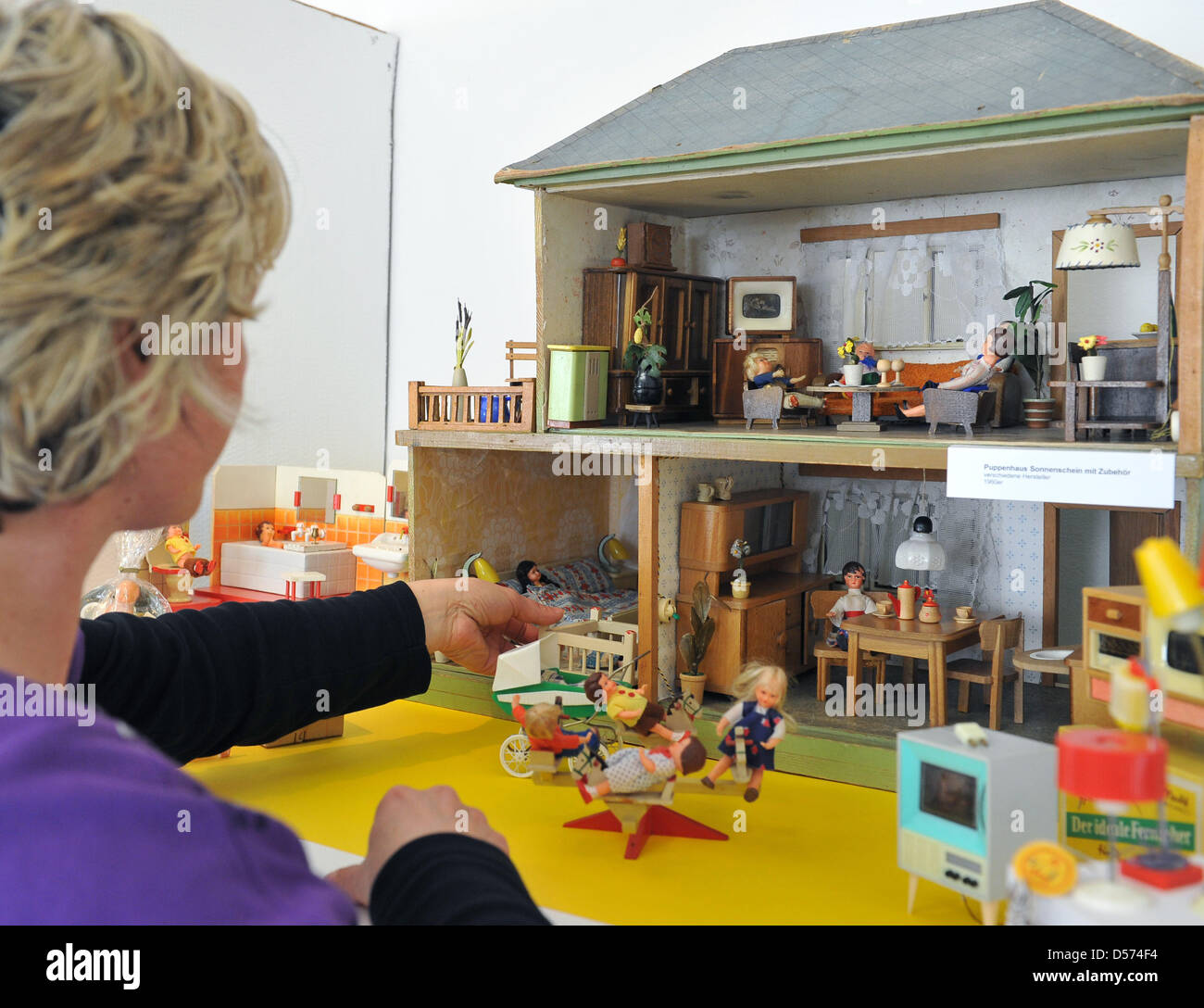 A Staff Member Of Alte Bischofsburg Museum Arranges A Doll S House