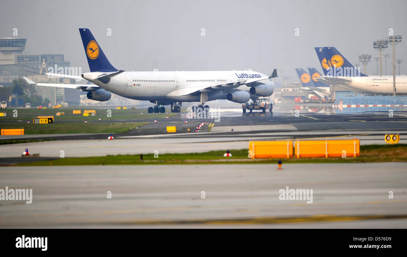 A Lufthansa air carrier taxies over the manoeuvring area at Frankfurt International airport in Frankfurt / Main, Germany, 19 April 2010. After almost four days standstill because of the volcanic eruption in Iceland, which caused an ash cloud, the air traffic in Germany started again under restrictions. Photo: Marius Becker Stock Photo
