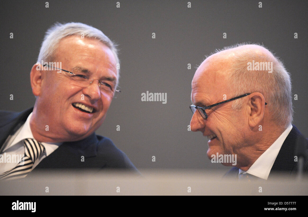 Martin Winterkorn (L), CEO of Volkswagen AG, talks to Ferdinand Piech, chairman of the supervisory board, at the company's general meeting in Hamburg, Germany, 22 April 2010. Europe's largest automaker Volkswagen increased its profits in the first quarter of 2010. The earnings after taxes increased by nearly 95 per cent to 473 million euros, the turnover increased by 19 per cent to Stock Photo