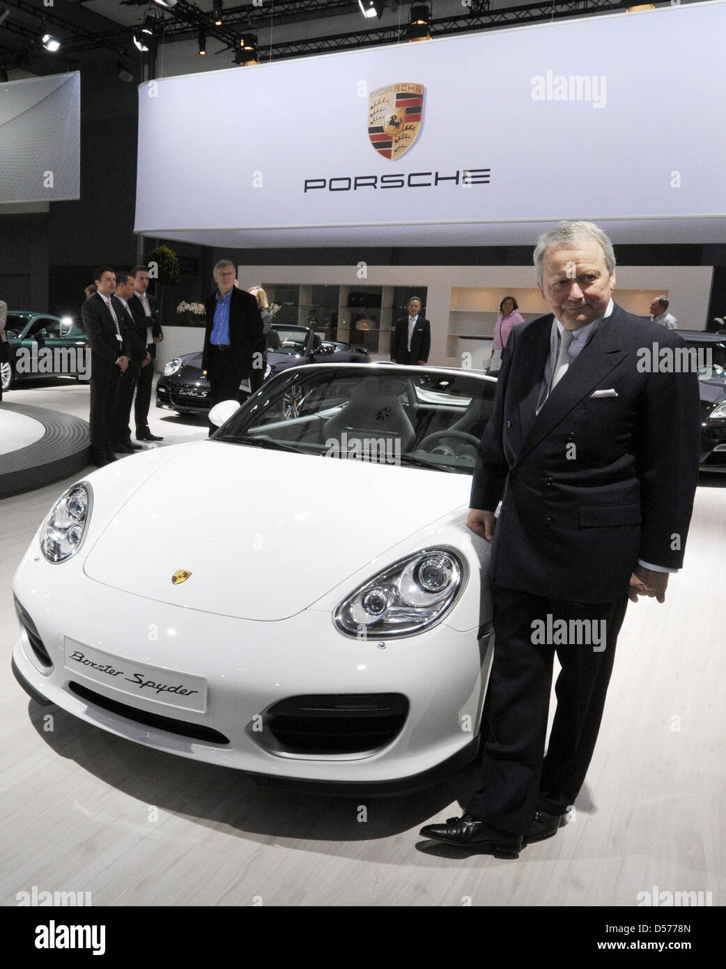 Wolfgang Porsche, chairman of the Porsche AG supervisory board, poses next to a Porsche Boxter Spyder prior to the general meeting of Volkswagen AG in Hamburg, Germany, 22 April 2010. Europe's largest automaker Volkswagen increased its profits in the first quarter of 2010. The earnings after taxes increased by nearly 95 per cent to 473 million euros, the turnover increased by 19 pe Stock Photo