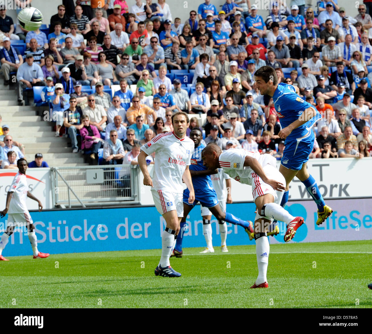 Munich's goalkeeper Stefan Ortega Moreno (R) catches the penalty shot by  Andreas Geipl of Regensburg (2-R) during the 2. Bundesliga relegation match  between Jahn Regensburg and TSV 1860 Munich at the Continental