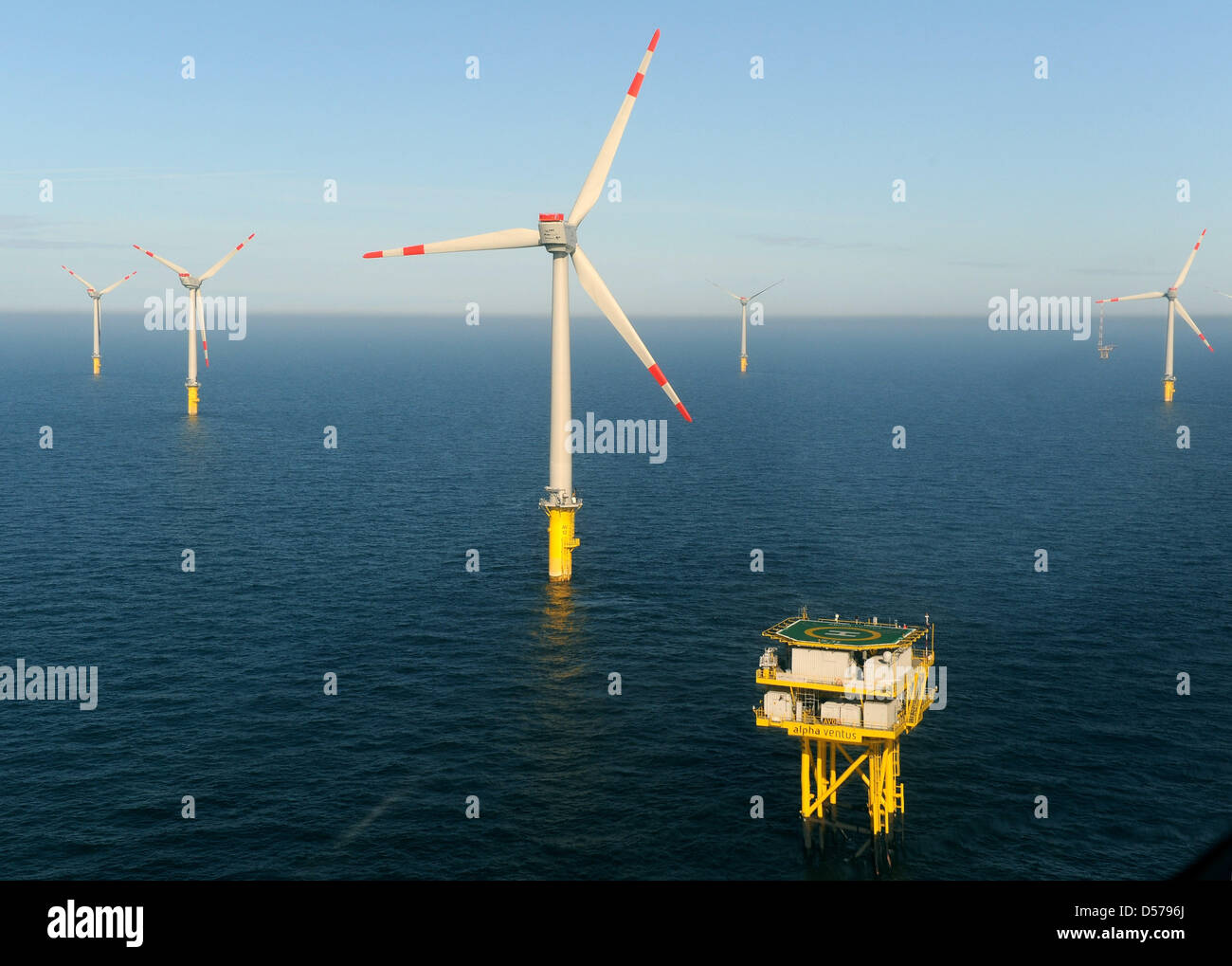 During the descent to the official induction of the first German Offshore-Windpark ''Alpha Ventus'', the transformer platform with the helicopter deck can be seen in the North Sea near Borkum, Germany, 27 April 2010. The test field consisting out of twelve wind turbines stands around 45 kilometers in front of the East Frisian island Borkum and can supply around 50,000 homes with el Stock Photo