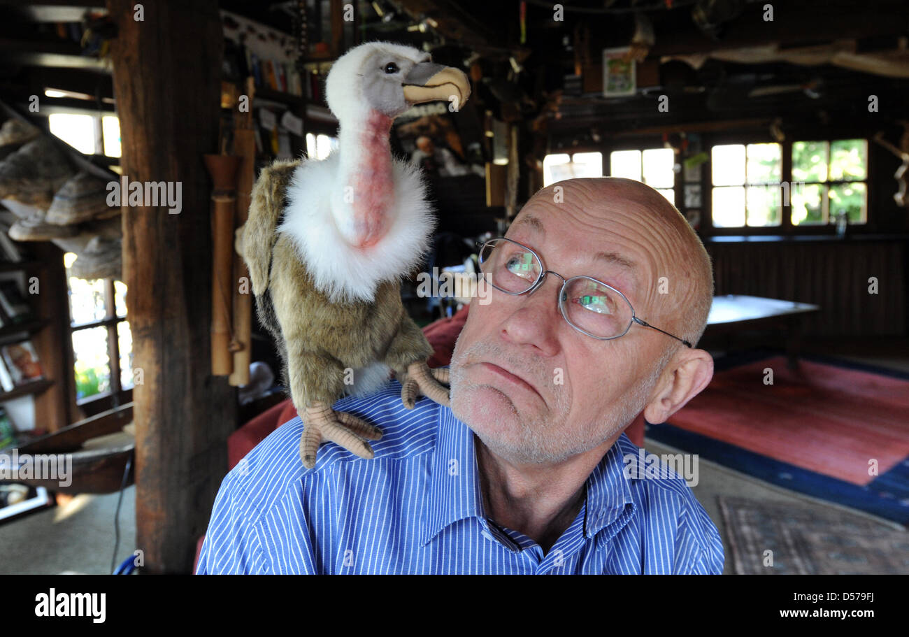 A vulture stuffed animal sits on the shoulder of adventurer and human  rights activist Ruediger Nehberg during a photo shoot in Rausdorf, Germany,  13 April 2010. On occasion of his 75th birthday,