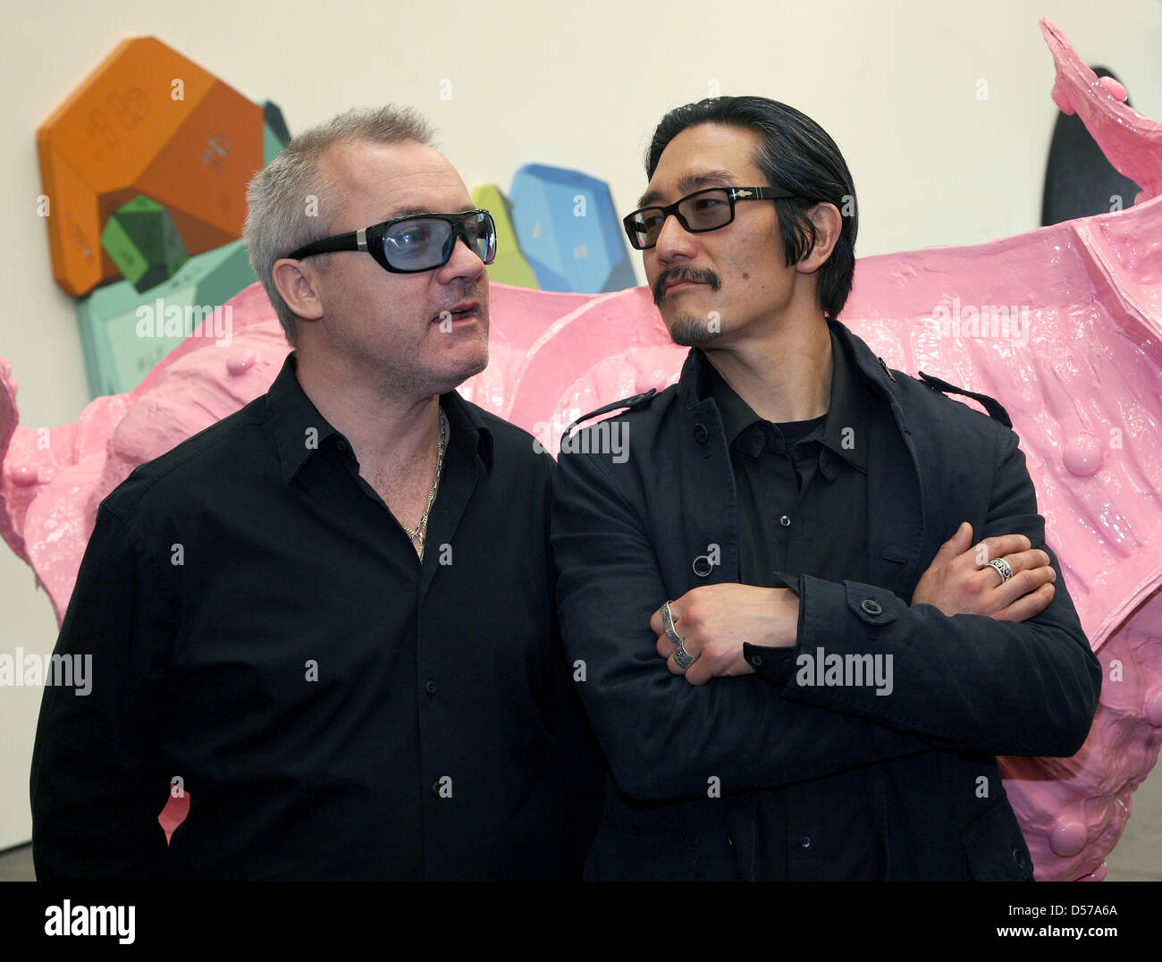 British artist Damien Hirst (L) and US American artist Michael Joo stand next to their works of art at the art gallery Haunch of Venison in Berlin, Germany, 30 April 2010. The exhibition 'Have You Ever Really Looked at the Sun?' is a collaboration between Hirst and Joo which opens on 01 May and can be visited until 14 August 2010. Photo: STEPHANIE PILICK Stock Photo