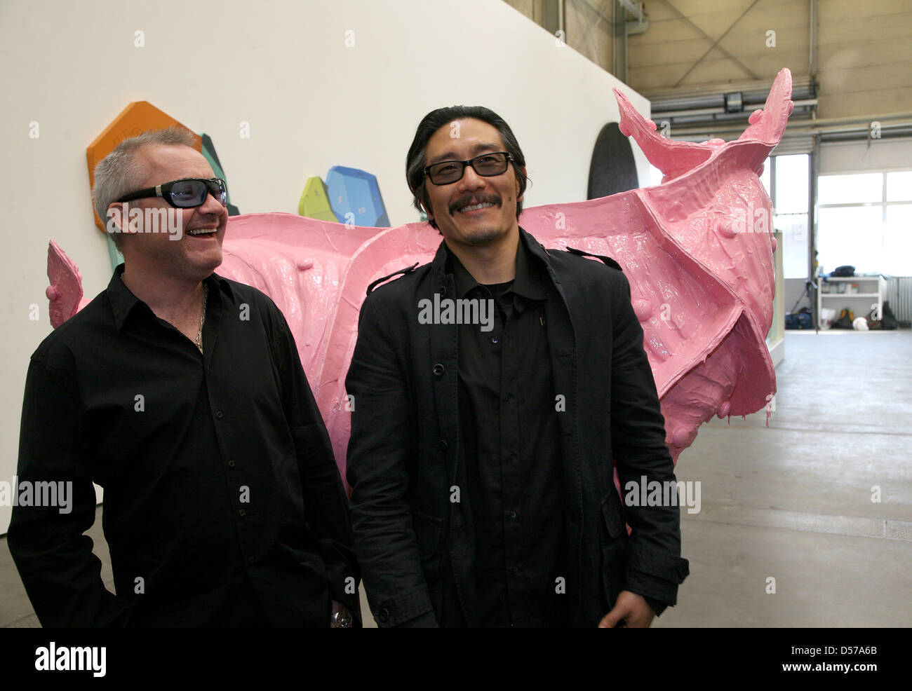 British artist Damien Hirst (L) and US American artist Michael Joo stand next to their works of art at the art gallery Haunch of Venison in Berlin, Germany, 30 April 2010. The exhibition 'Have You Ever Really Looked at the Sun?' is a collaboration between Hirst and Joo which opens on 01 May and can be visited until 14 August 2010. Photo: STEPHANIE PILICK Stock Photo