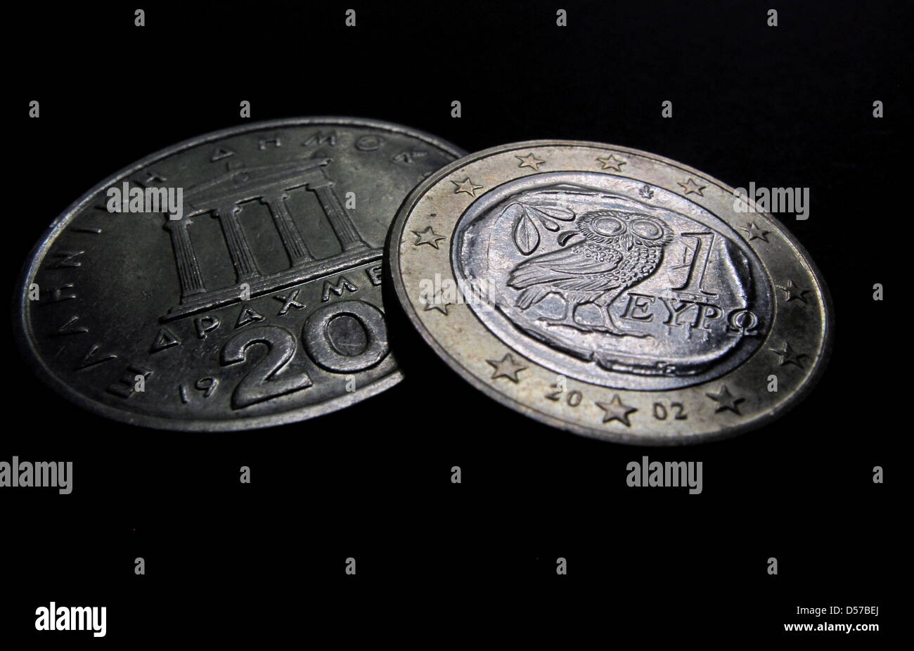 A Greek euro (R) and drachma (L) coin in Kaufbeuren, Germany, 03 May 2010. German federal government approved Germany's 22.4-billion-euro share of a multi- billion-euro Greek credit line, with a view to passing the law ahead of a eurozone summit at the end of the week. Photo: KARL-JOSEF HILDENBRAND Stock Photo