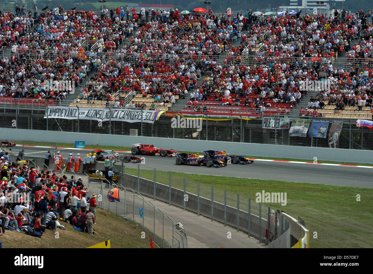 Australian driver Mark Webber of Red Bull Racing (R) leads the grid in ...