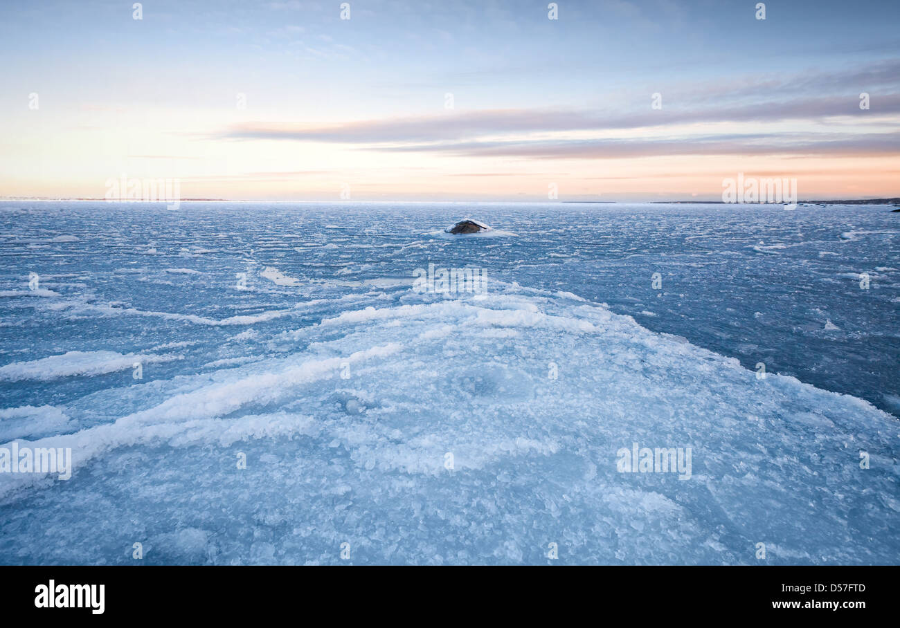 Winter landscape with ice on frozen Baltic Sea Stock Photo