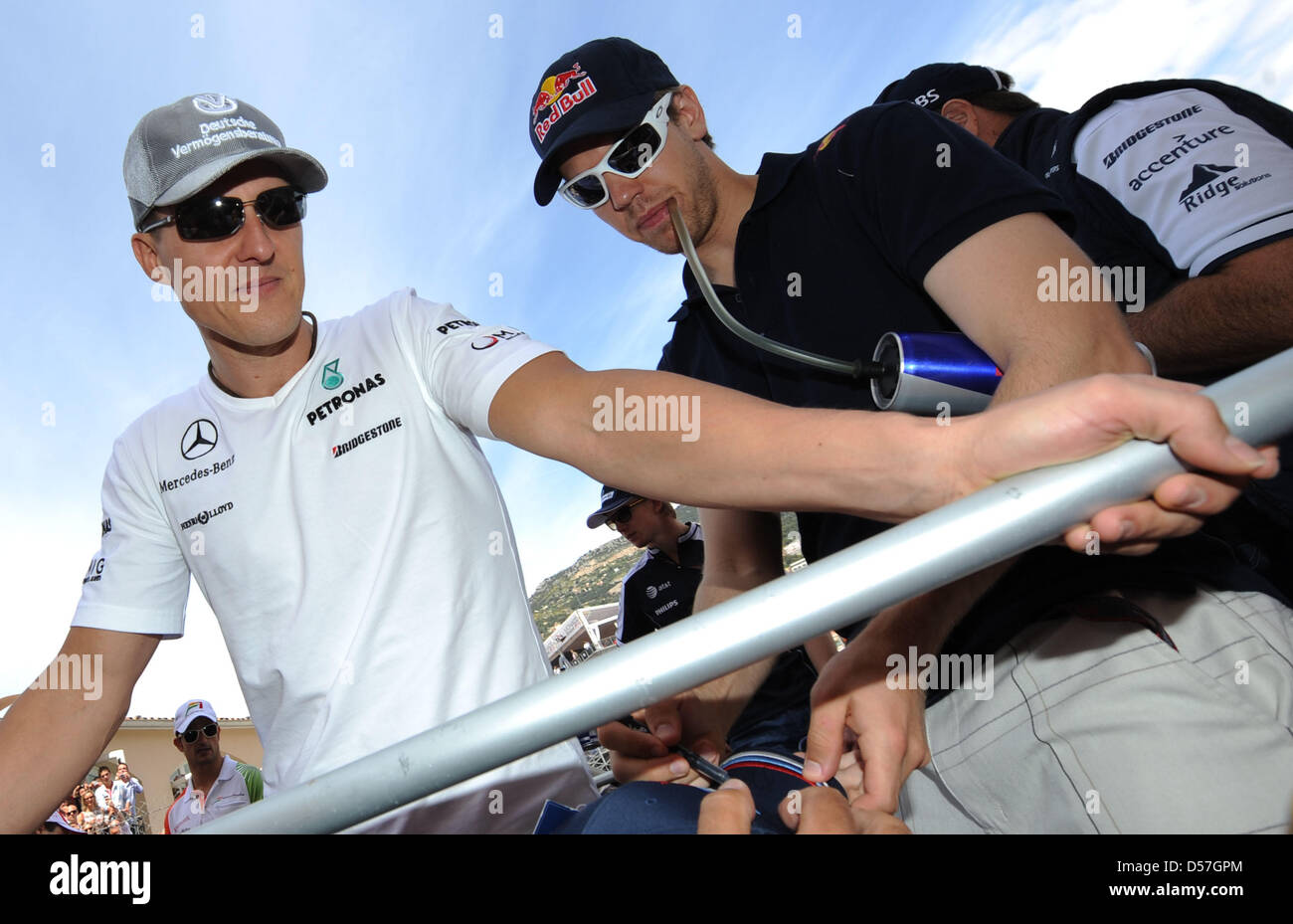 German driver Michael Schumacher of Mercedes GP (L) and compatriot Sebastian Vettel of RedBull Racing (R) arrive for the drivers' parade at the street citrcuit of Monte Carlo, Monaco, 16 May 2010. The 2010 Formula 1 Grand Prix of Monaco is held on the street circuit of the Pricipality. Photo: Peter Steffen Stock Photo