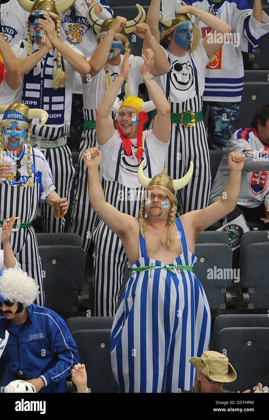Finnish fans cheer their team during the Ice Hockey World Championship group E match Finland vs Slovakia at Lanxess Arena in Cologne, Germany, 17 May 2010. Photo: ACHIM SCHEIDEMANN (ATTENTION EDITORIAL USAGE ONLY!) Stock Photo