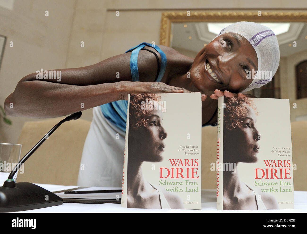 Former model Waris Dirie presents her new book 'Schwarze Frau, weißes Land' ('Black Woman, White Country') during a press conference at hotel Adlon in Berlin, Germany, 18 May 2010. In the book, Dirie talks about her life in the new, white home and her longing for Africa. Photo: JENS KALAENE Stock Photo
